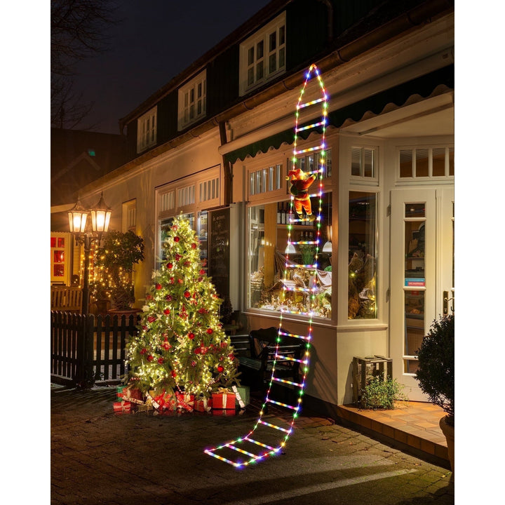 Kletternder Weihnachtsmann Leiter Lichter