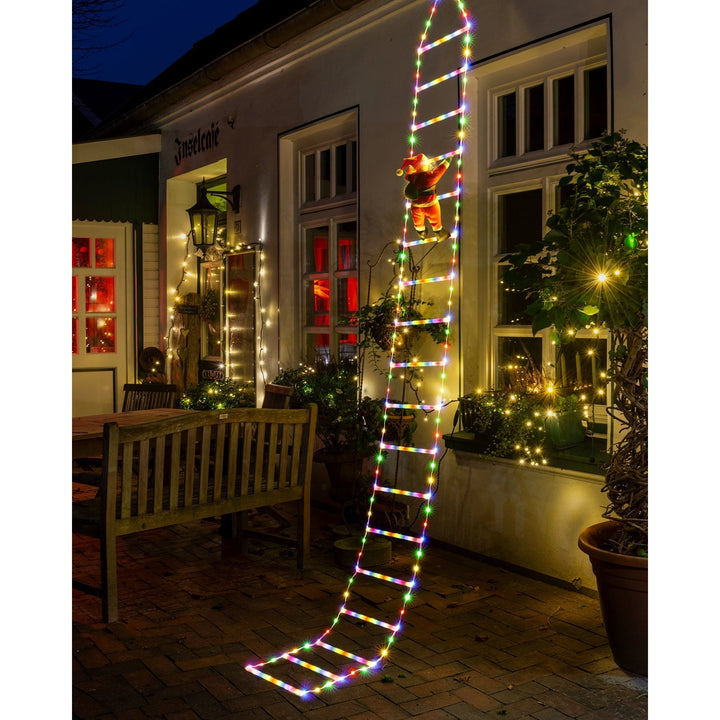 Kletternder Weihnachtsmann Leiter Lichter