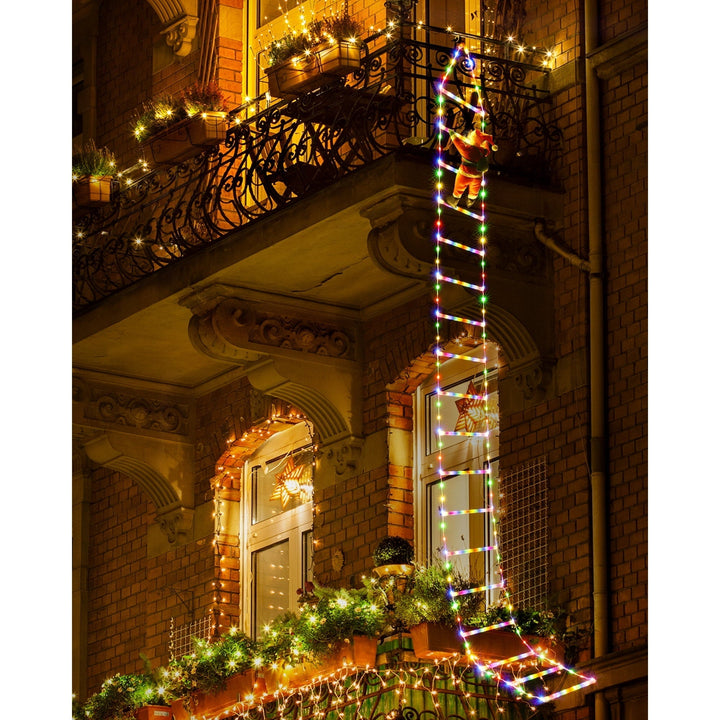 Kletternder Weihnachtsmann Leiter Lichter